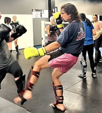 Coach DJ sparring during a boxing class at Rumble Martial Arts in Keswick.