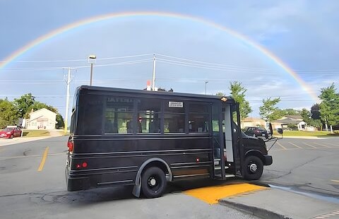 The Rumble after-school bus parked under a rainbow in Keswick.
