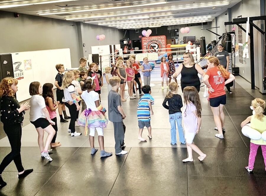 Kids playing a group game on the mats at Rumble Martial Arts in Keswick.