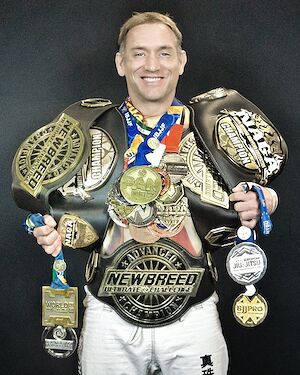 Coach Jones with his belts and medals from two decades of competition.