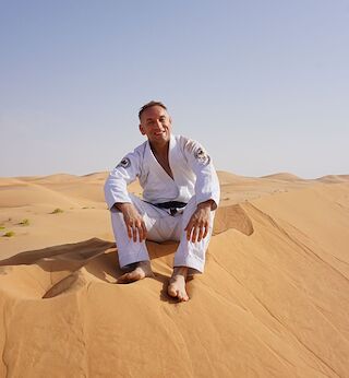 Professor Jones in his gi in the desert in Abu Dhabi, where he represented Canada at the World Pro each year.